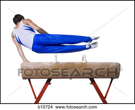 Picture - Male gymnast performing on vaulting horse. Fotosearch
