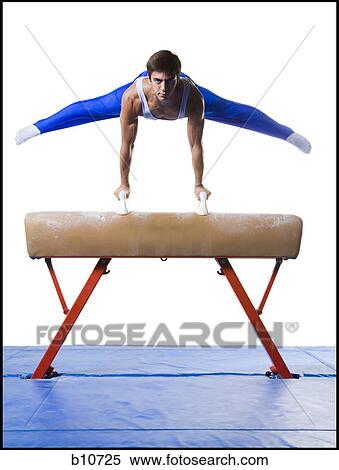 Male gymnast performing on vaulting horse View Large Photo Image Stock Photography - Male gymnast performing on vaulting horse. Fotosearch