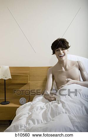 Male mannequin sitting on the bed and laughing View Large Photo Image Stock Image - Male mannequin sitting on the bed and laughing. Fotosearch