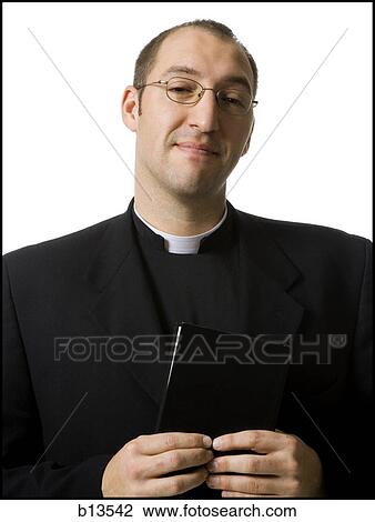 Male priest with bible View Large Photo Image Stock Image - Male priest with bible. Fotosearch
