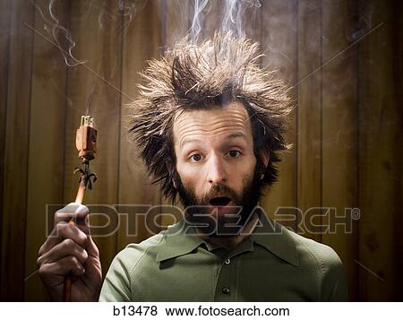 Man after electric shock with electric plug and smoke View Large Photo Image Stock Photo - Man after electric shock with electric plug and smoke. Fotosearch