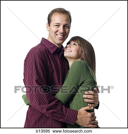Man and girl embracing View Large Photo Image Stock Photography - Man and girl embracing. Fotosearch