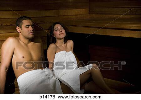 Stock Photo - Man and woman in sauna relaxing. Fotosearch