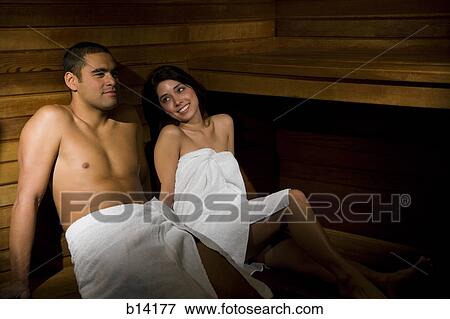 Man and woman in sauna smiling View Large Photo Image Stock Photo - Man and woman in sauna smiling. Fotosearch