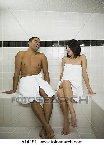 Man and woman in steam bath with towels smiling View Large Photo Image Stock Image - Man and woman in steam bath with towels smiling. Fotosearch