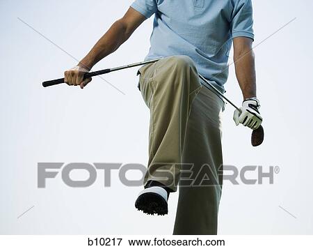 Man breaking a golf club View Large Photo Image Stock Photo - Man breaking a golf club. Fotosearch