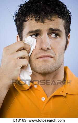 Man crying with tissue View Large Photo Image Stock Image - Man crying with tissue. Fotosearch