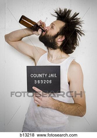 Man drinking beer holding blank sign and cigarette View Large Photo Image Stock Photo - Man drinking beer holding blank sign and cigarette. Fotosearch