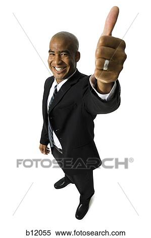 Stock Photography - Man giving thumbs-up signal. Fotosearch