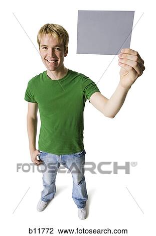 Man holding a blank sign View Large Photo Image Stock Image - Man holding a blank sign. Fotosearch