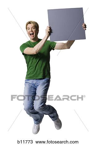 Stock Image - Man holding a blank sign. Fotosearch