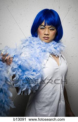 Man in blue wig and feather boa flirting View Large Photo Image Stock Image - Man in blue wig and feather boa flirting. Fotosearch