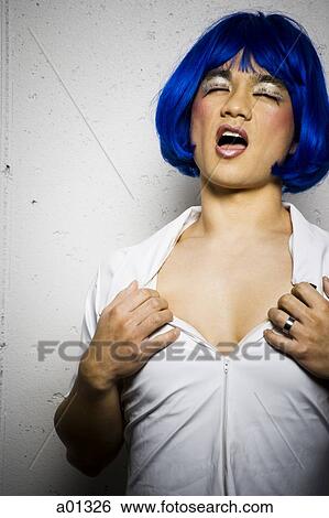 Man in blue wig and makeup flirting View Large Photo Image Stock Photograph - Man in blue wig and makeup flirting. Fotosearch