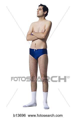 Man in swimsuit and socks with arms crossed View Large Photo Image Stock Photograph - Man in swimsuit and socks with arms crossed. Fotosearch