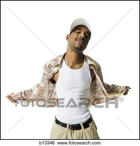 Man in undershirt with cap posing View Large Photo Image Stock Photograph - Man in undershirt with cap posing. Fotosearch