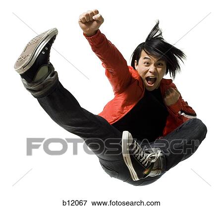 Stock Photo - Man leaping and kicking. Fotosearch