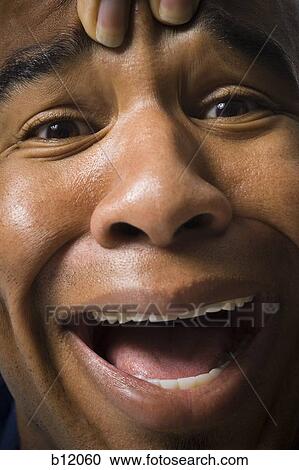 Man making a funny face View Large Photo Image Stock Image - Man making a funny face. Fotosearch