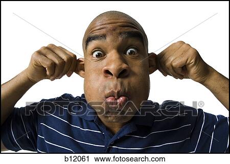 Man making a funny face View Large Photo Image Stock Image - Man making a funny face. Fotosearch