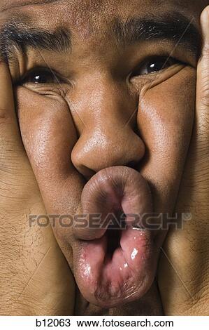 Man making a funny face View Large Photo Image Stock Image - Man making a funny face. Fotosearch