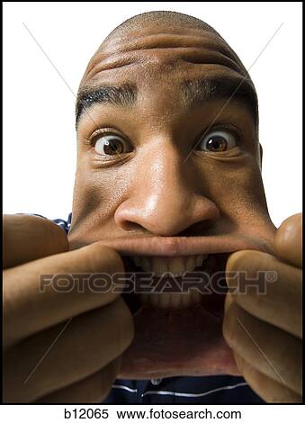 Man making a funny face View Large Photo Image Stock Photography - Man making a funny face. Fotosearch