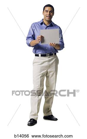 Man standing with blank sign smiling View Large Photo Image Stock Photograph - Man standing with blank sign smiling. Fotosearch