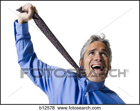 Stock Photo - Man strangling himself with necktie. Fotosearch