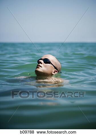 Man swimming in the sea View Large Photo Image Stock Photo - Man swimming in the sea. Fotosearch