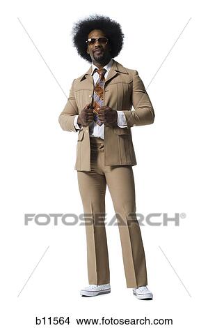 Picture - Man with an afro in beige suit. Fotosearch