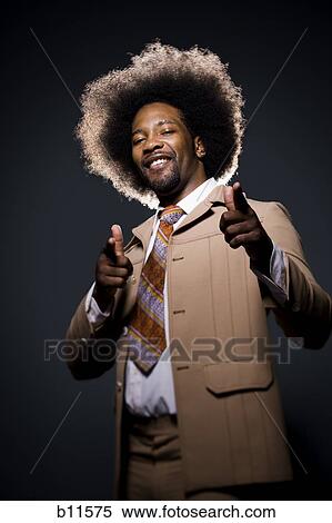 Man with an afro in beige suit View Large Photo Image Stock Photography - Man with an afro in beige suit. Fotosearch