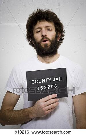 Man with beard holding blank sign View Large Photo Image Stock Photograph - Man with beard holding blank sign. Fotosearch