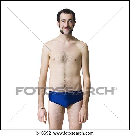 Man with beard standing in swimsuit View Large Photo Image Stock Image - Man with beard standing in swimsuit. Fotosearch