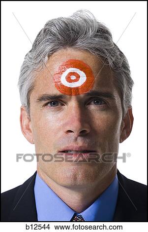 Man with bull's-eye on forehead View Large Photo Image Picture - Man with bull's-eye on forehead. Fotosearch