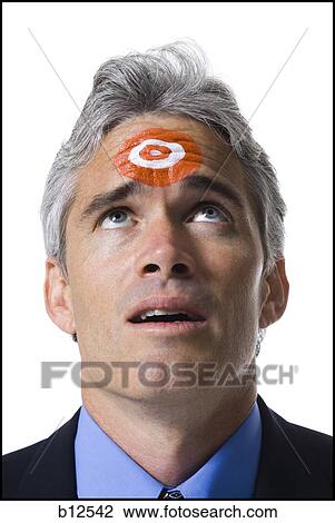 Man with bull's-eye on forehead View Large Photo Image Stock Image - Man with bull's-eye on forehead. Fotosearch