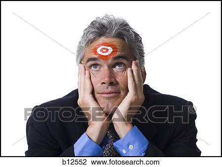 Man with bull's-eye on forehead View Large Photo Image Stock Image - Man with bull's-eye on forehead. Fotosearch