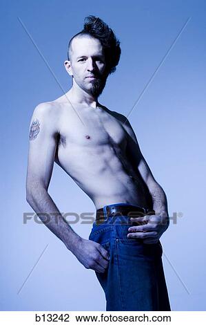 Man with half shaved hair and beard View Large Photo Image Stock Image - Man with half shaved hair and beard. Fotosearch