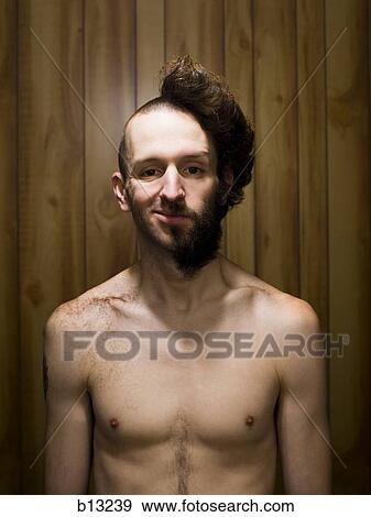 Man With Half Shaved Head And Beard Half Smiling Stock Photo