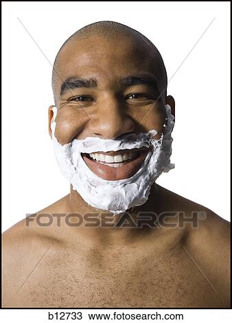 Man with shaving lotion on face View Large Photo Image Stock Image - Man with shaving lotion on face. Fotosearch