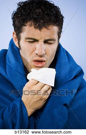 Man wrapped in blanket with tissue View Large Photo Image Stock Image - Man wrapped in blanket with tissue. Fotosearch