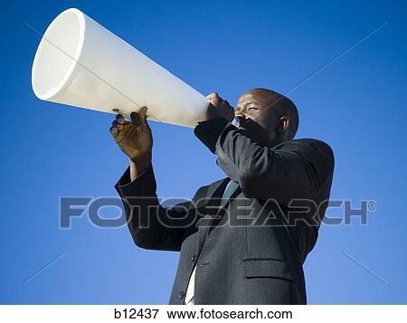Stock Photo - Man yelling through bullhorn. Fotosearch