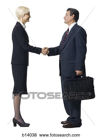 Mature businessman and woman shaking hands View Large Photo Image Stock Photo - Mature businessman and woman shaking hands. Fotosearch