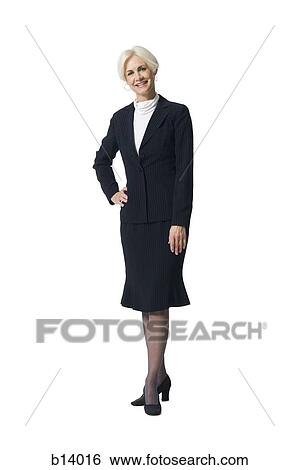 Mature businesswoman standing and smiling View Large Photo Image Stock Photograph - Mature businesswoman standing and smiling. Fotosearch