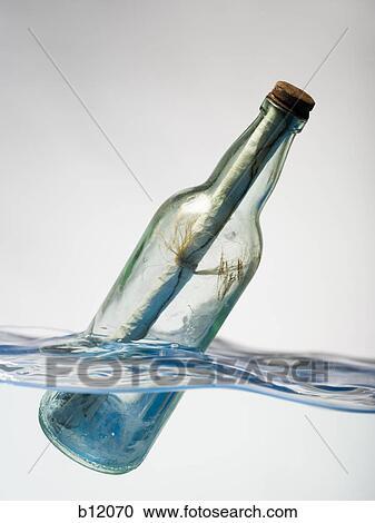 Message in a floating bottle View Large Photo Image Stock Image - Message in a floating bottle. Fotosearch