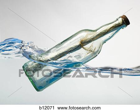 Stock Image - Message in a floating bottle. Fotosearch