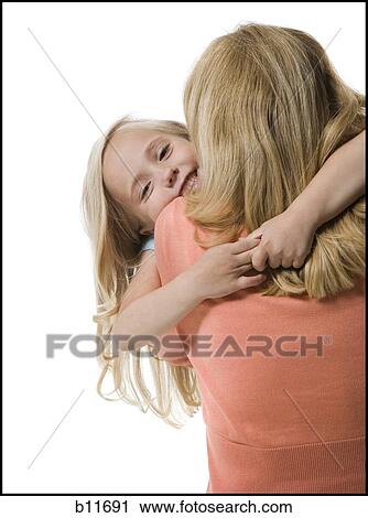 Mother and daughter embracing View Large Photo Image Stock Image - Mother and daughter embracing. Fotosearch