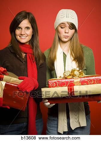 Mother and daughter with Christmas gifts View Large Photo Image Stock Photo - Mother and daughter with Christmas gifts. Fotosearch