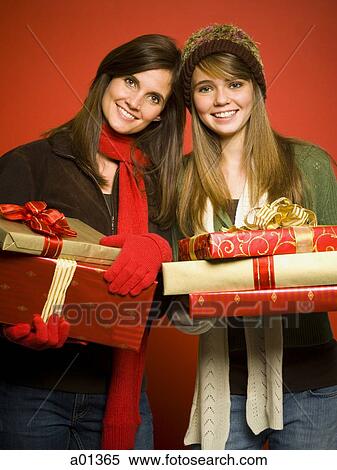 Mother and daughter with Christmas gifts View Large Photo Image Stock Photography - Mother and daughter with Christmas gifts. Fotosearch