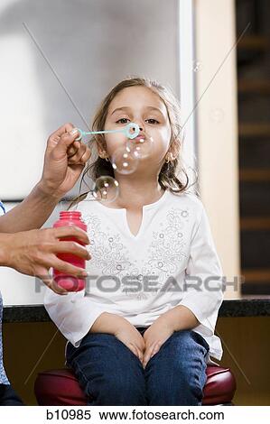 Mother and young daughter blowing bubbles View Large Photo Image Stock Photography - Mother and young daughter blowing bubbles. Fotosearch
