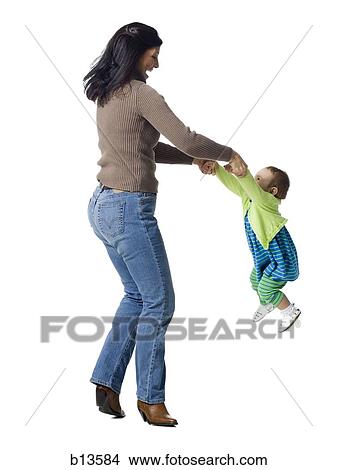 Mother swinging baby View Large Photo Image Picture - Mother swinging baby. Fotosearch