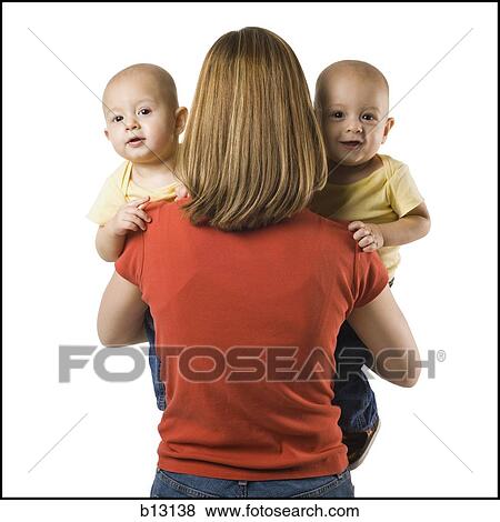 Stock Photo - Mother with twin babies. Fotosearch