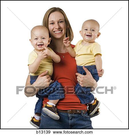 Mother with twin baby boys View Large Photo Image Stock Photo - Mother with twin baby boys. Fotosearch